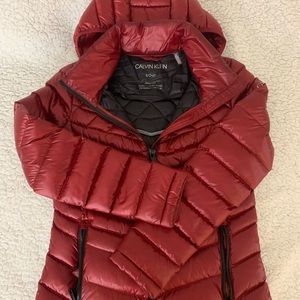 One used. Like new. Sizs S. Calvin Klein jacket. Packable, premium down blend.